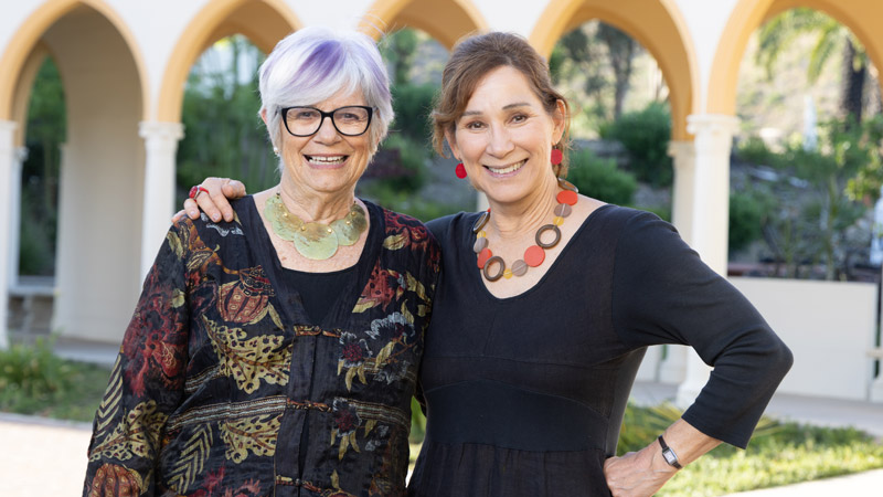 Outdoor image of two ladies smiling